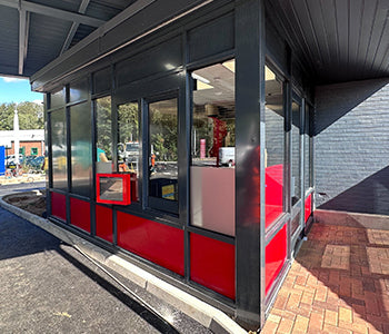 A new Five Guys drive thru booth installation with an integrated sliding window and door.